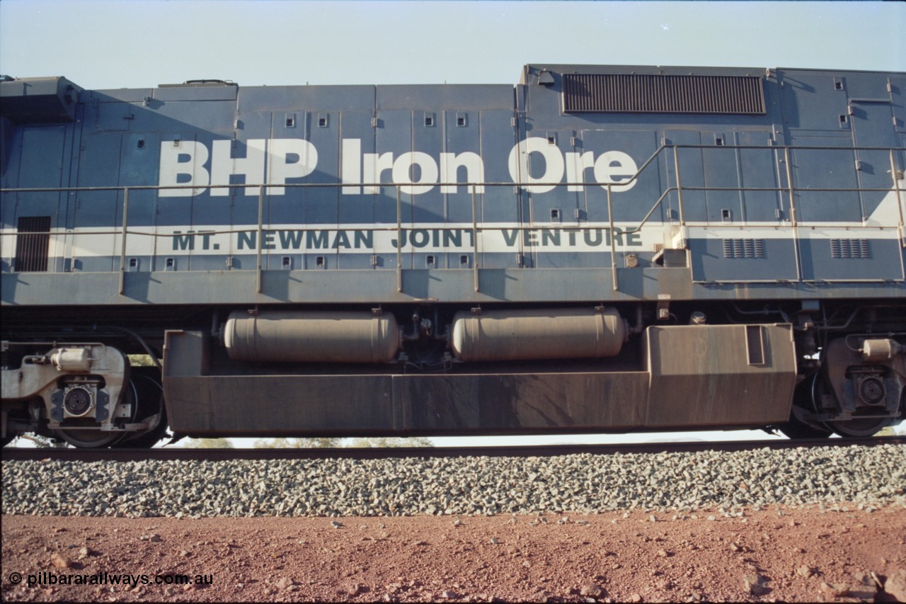 234-23
Yandi Two, BHP Iron Ore Goninan rebuild CM39-8 GE unit 5630 'Zeus' serial 5831-09 / 88-079 is second unit on the front of a 240 waggon loaded train, engine hood and fuel tank arrangement view, note the difference to the ALCo rebuilds. Circa 1998.
Keywords: 5630;Goninan;GE;CM39-8;5831-09/88-079;