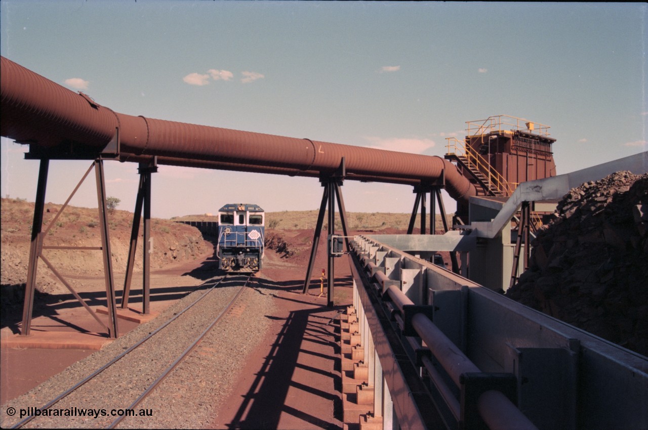 235-04
Yandi Two, BHP Iron Ore Goninan rebuild CM40-8M GE unit 5652 'Villanueva' serial 8412-09 / 93-143 arrives with the afternoon 240 waggon empty train, the hydraulic lines and dust extraction equipment frame the loco.
Keywords: 5652;Goninan;GE;CM40-8M;8412-09/93-143;rebuild;AE-Goodwin;ALCo;M636C;5482;G6061-3;