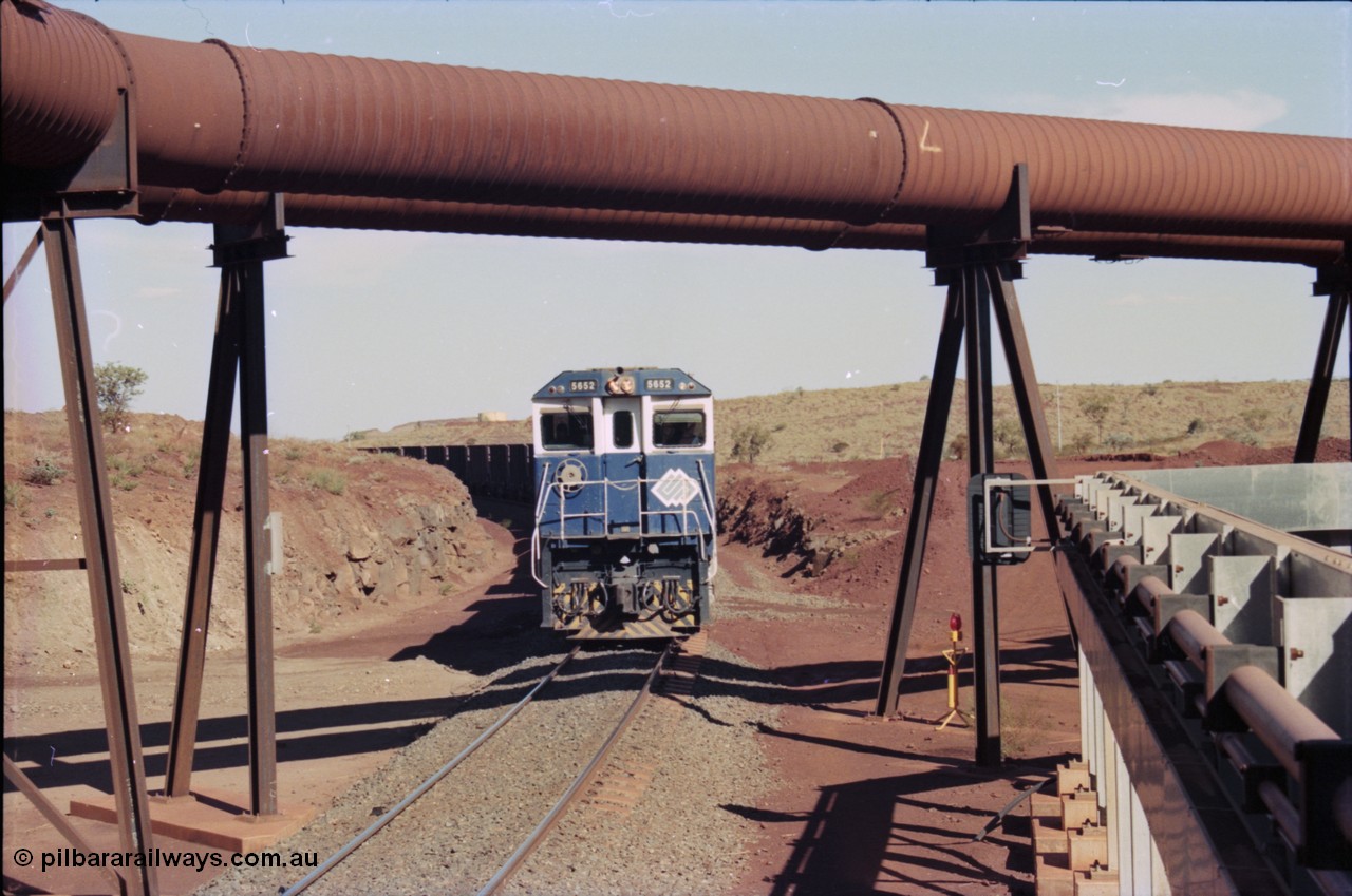 235-06
Yandi Two, BHP Iron Ore Goninan rebuild CM40-8M GE unit 5652 'Villanueva' serial 8412-09 / 93-143 arrives with the afternoon 240 waggon empty train, the hydraulic lines and dust extraction equipment frame the loco.
Keywords: 5652;Goninan;GE;CM40-8M;8412-09/93-143;rebuild;AE-Goodwin;ALCo;M636C;5482;G6061-3;