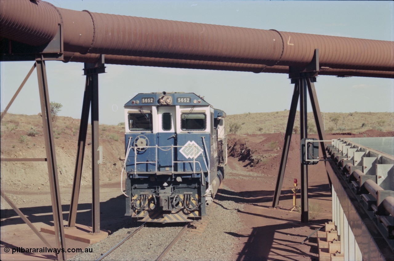 235-07
Yandi Two, BHP Iron Ore Goninan rebuild CM40-8M GE unit 5652 'Villanueva' serial 8412-09 / 93-143 arrives with the afternoon 240 waggon empty train, the hydraulic lines and dust extraction equipment frame the loco.
Keywords: 5652;Goninan;GE;CM40-8M;8412-09/93-143;rebuild;AE-Goodwin;ALCo;M636C;5482;G6061-3;