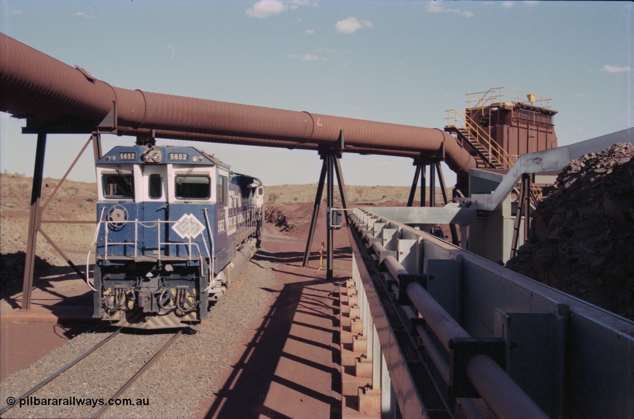 235-09
Yandi Two, BHP Iron Ore Goninan rebuild CM40-8M GE unit 5652 'Villanueva' serial 8412-09 / 93-143 arrives with the afternoon 240 waggon empty train, the hydraulic lines and dust extraction equipment frame the loco.
Keywords: 5652;Goninan;GE;CM40-8M;8412-09/93-143;rebuild;AE-Goodwin;ALCo;M636C;5482;G6061-3;