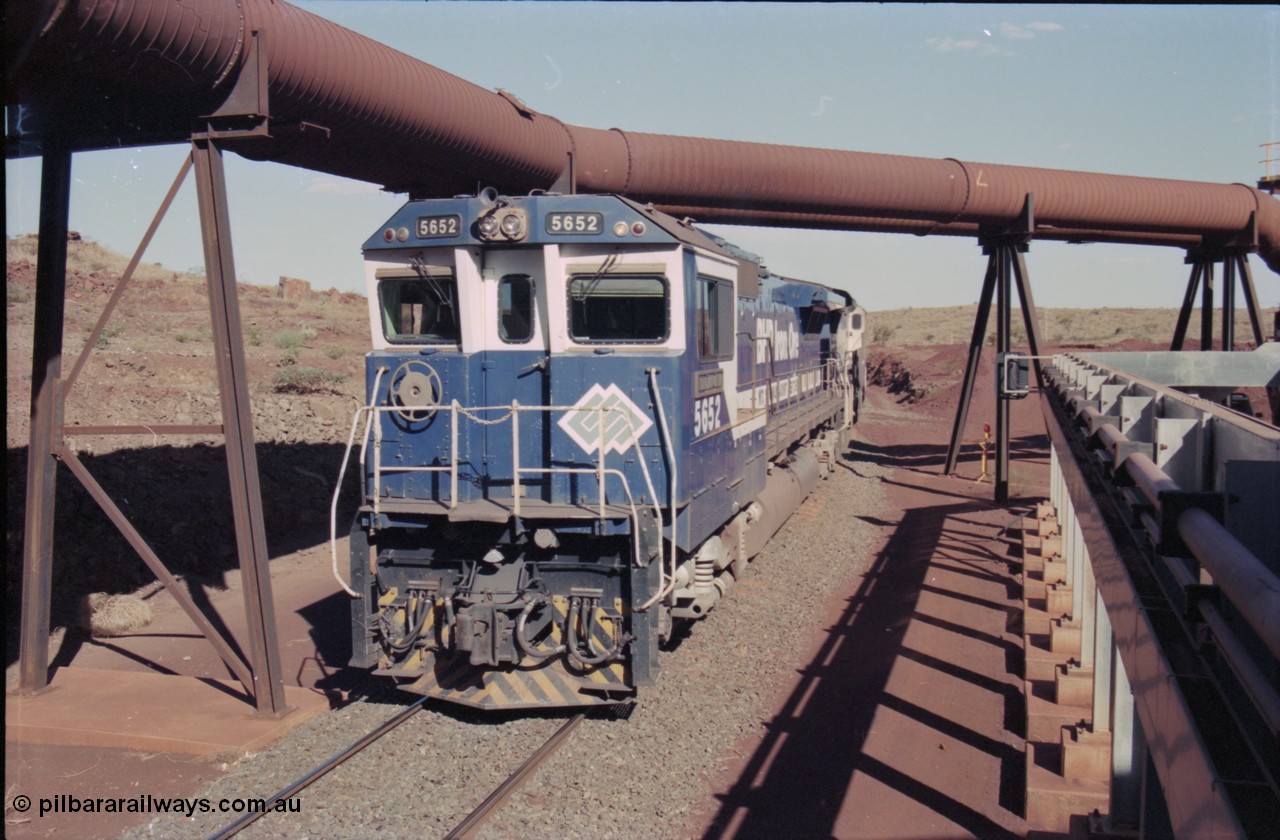 235-10
Yandi Two, BHP Iron Ore Goninan rebuild CM40-8M GE unit 5652 'Villanueva' serial 8412-09 / 93-143 arrives with the afternoon 240 waggon empty train, the hydraulic lines and dust extraction equipment frame the loco.
Keywords: 5652;Goninan;GE;CM40-8M;8412-09/93-143;rebuild;AE-Goodwin;ALCo;M636C;5482;G6061-3;