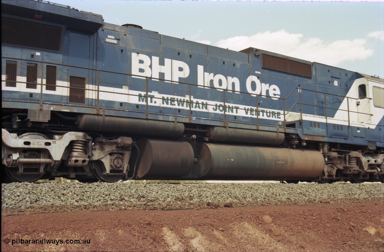 235-26
Yandi One, BHP Iron Ore Goninan rebuild CM40-8M GE unit 5639 'Corunna Downs' serial 8281-03 / 92-128 sits on a loaded train as second unit awaiting departure time. Note the fuel tank and air receiver unit that tells it was an AE Goodwin built C636 ALCo before rebuild.
Keywords: 5639;Goninan;GE;CM40-8M;8281-03/92-128;rebuild;AE-Goodwin;ALCo;C636;5459;G6027-3;