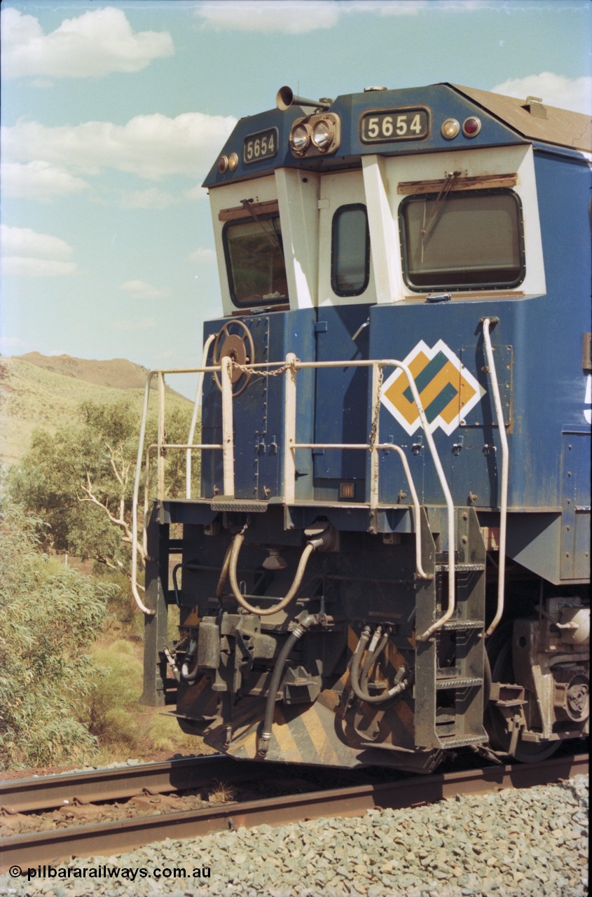 235-32
Yandi One, BHP Iron Ore Goninan rebuild CM40-8M GE unit 5654 'Kashima' serial 8412-11 / 93-145 sits on a loaded train awaiting departure time and also has the late marigold style BHP logo, cab front pilot.
Keywords: 5654;Goninan;GE;CM40-8M;8412-11/93-145;rebuild;Comeng-NSW;ALCo;M636C;5493;C6084-9;