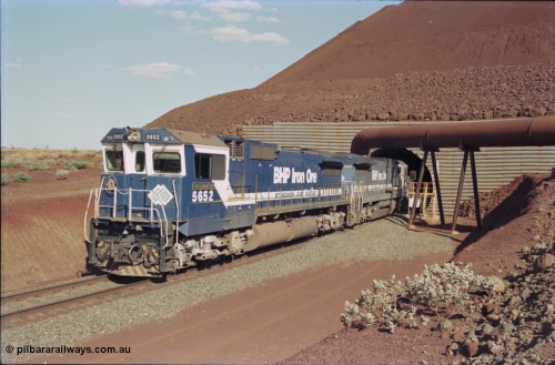 235-16
Yandi Two, BHP Iron Ore Goninan rebuild CM40-8M GE unit 5652 'Villanueva' serial 8412-09 / 93-143 leads the afternoon 240 waggon train with second unit Goninan built CM39-8 unit 5630 'Zeus' as the exit the loadout tunnel, notice the fuel tank differences between the lead unit an ALCo rebuild and the second unit built new.
Keywords: 5652;Goninan;GE;CM40-8M;8412-09/93-143;rebuild;AE-Goodwin;ALCo;M636C;5482;G6061-3;
