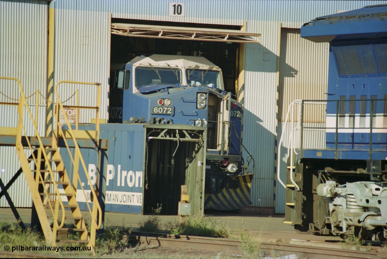 236-05
Nelson Point, Loco Overhaul Shop, BHP AC6000 class locomotive 6072 'Hesta', a General Electric built AC6000 model, serial 51064, seen here in the shed having the windscreen protectors or 'blinkers' fitted.
Keywords: 6072;GE;AC6000;51064;