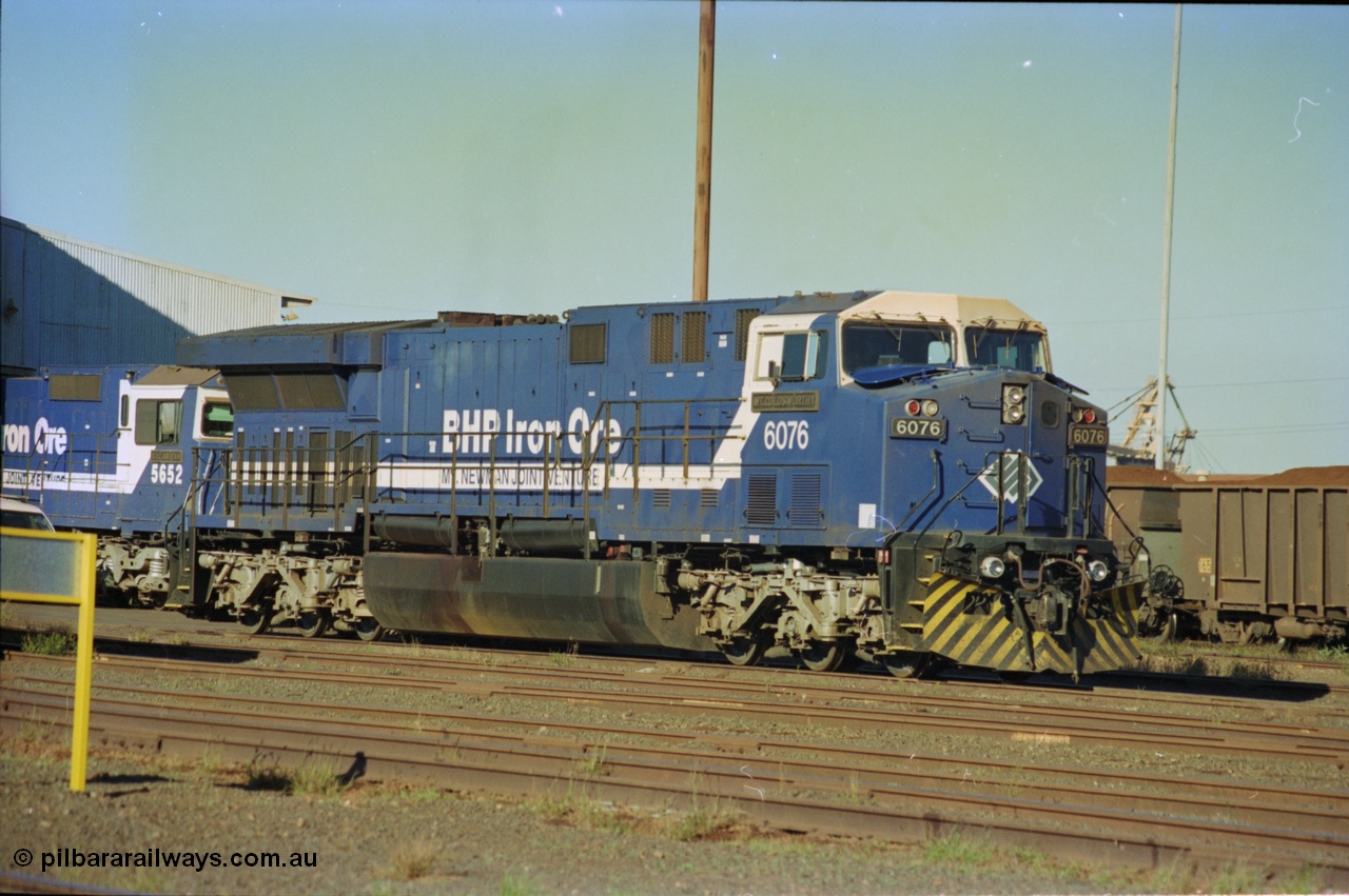 236-14
Nelson Point Loco Overhaul Shop, BHP Iron Ore's General Electric built AC6000 unit 6076 'Mt Goldsworthy' serial 51068 sits out the front with new windscreen protectors or 'blinkers' fitted.
Keywords: 6076;GE;AC6000;51068;