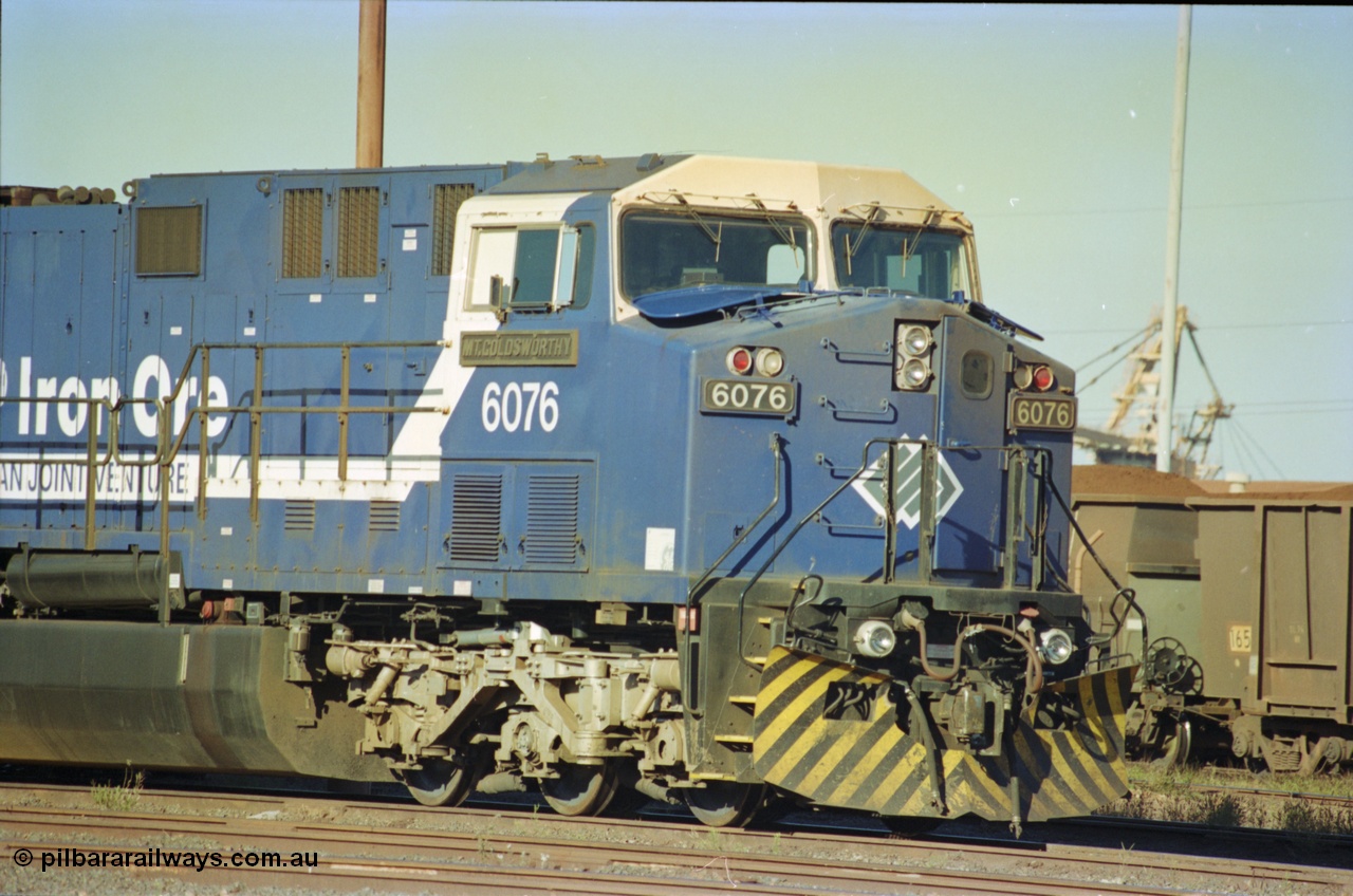 236-15
Nelson Point Loco Overhaul Shop, BHP Iron Ore's General Electric built AC6000 unit 6076 'Mt Goldsworthy' serial 51068 sits out the front with new windscreen protectors or 'blinkers' fitted.
Keywords: 6076;GE;AC6000;51068;