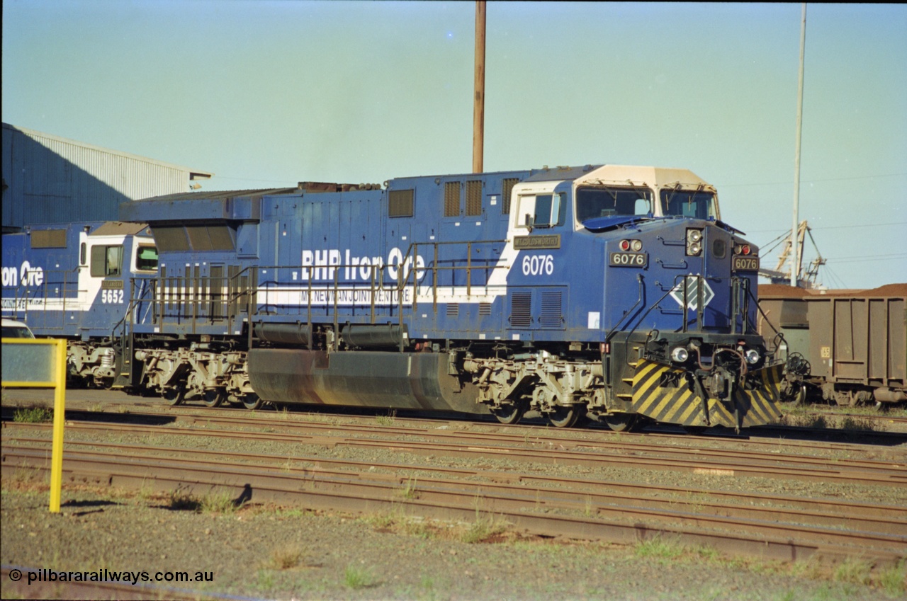 236-16
Nelson Point Loco Overhaul Shop, BHP Iron Ore's General Electric built AC6000 unit 6076 'Mt Goldsworthy' serial 51068 sits out the front with new windscreen protectors or 'blinkers' fitted.
Keywords: 6076;GE;AC6000;51068;