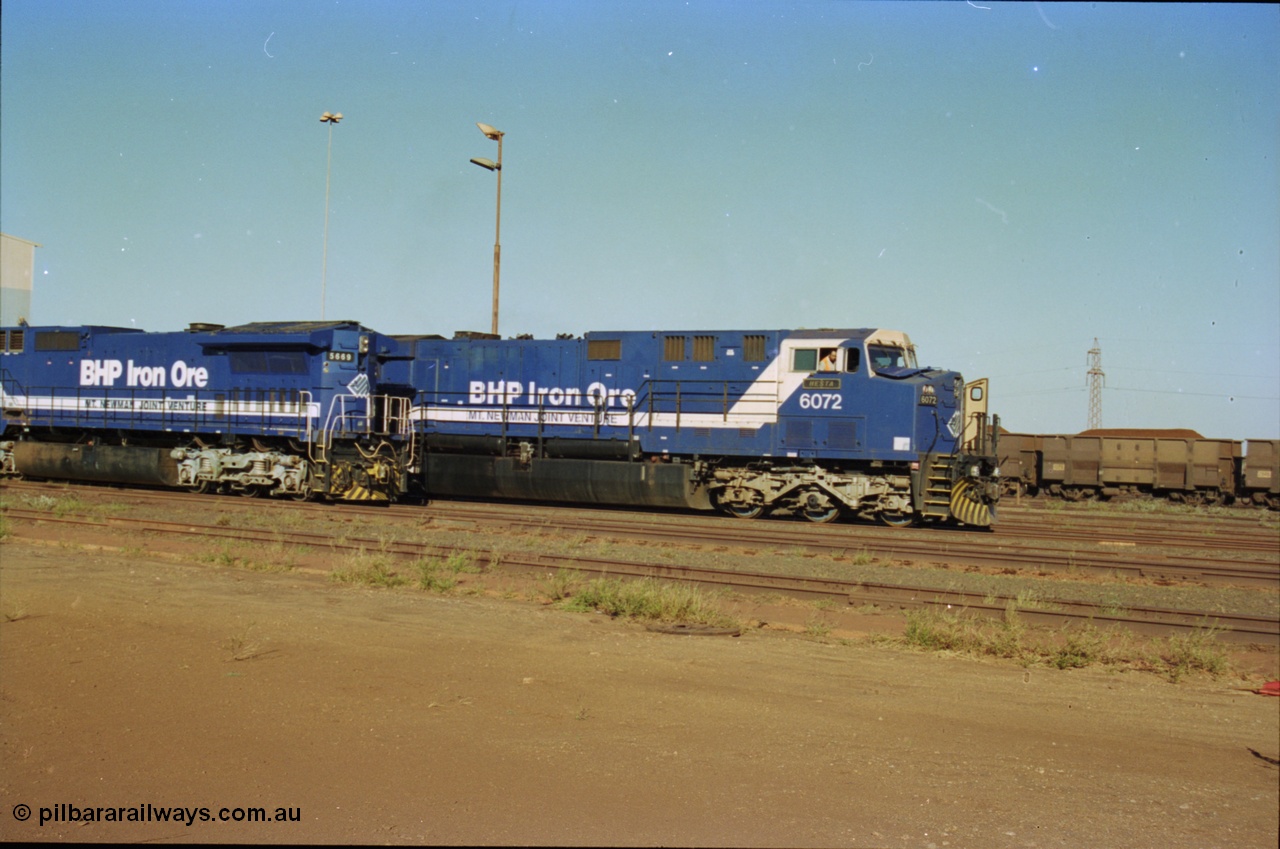 236-25
Nelson Point Loco Overhaul Shop, BHP Iron Ore's Goninan GE rebuilt CM40-8MEFI unit 5669 'Beilun' serial 8412-02 / 95-160 sits out the front awaiting attention, with AC6000 units 6072 being driven out.
Keywords: 5669;Goninan;GE;CM40-8EFI;8412-02/95-160;rebuild;Comeng-NSW;ALCo;M636C;5486;C6084-2;