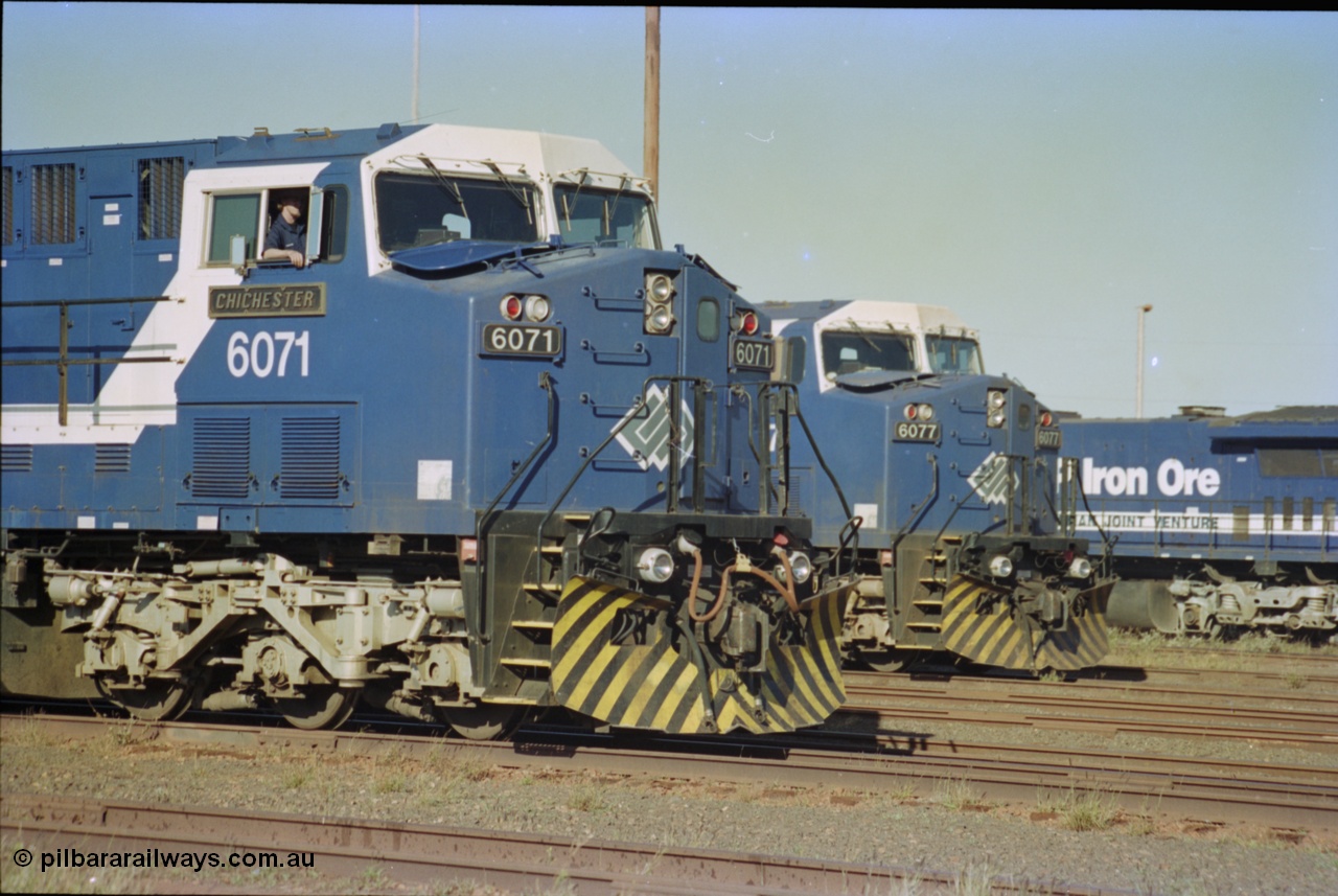 236-31
Nelson Point Loco Overhaul Shop, BHP Iron Ore's General Electric built AC6000 unit 6071 'Chichester' serial 51063 sits out the front with new windscreen protectors or 'blinkers' fitted next to sister unit 6077.
Keywords: 6071;GE;AC6000;51063;