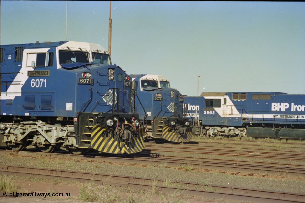 236-32
Nelson Point Loco Overhaul Shop, BHP Iron Ore's General Electric built AC6000 unit 6071 'Chichester' serial 51063 sits out the front with new windscreen protectors or 'blinkers' fitted next to sister unit 6077.
Keywords: 6071;GE;AC6000;51063;