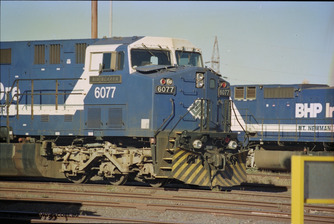 236-33
Nelson Point Loco Overhaul Shop, BHP Iron Ore's General Electric built AC6000 unit 6077 'Nimingarra' serial 51069 sits out the front.
Keywords: 6077;GE;AC6000;51069;