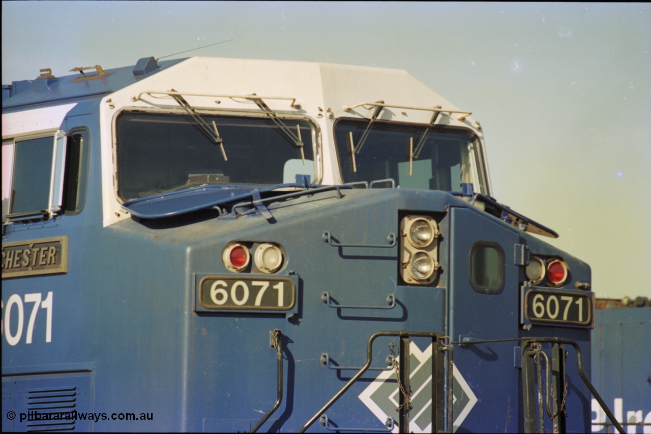 236-34
Nelson Point Loco Overhaul Shop, BHP Iron Ore's General Electric built AC6000 unit 6071 'Chichester' serial 51063 sits out the front with new windscreen protectors or 'blinkers' fitted.
Keywords: 6071;GE;AC6000;51063;