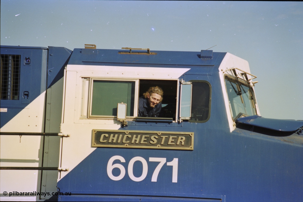 236-35
Nelson Point Loco Overhaul Shop, BHP Iron Ore's General Electric built AC6000 unit 6071 'Chichester' serial 51063 sits out the front with new windscreen protectors or 'blinkers' fitted, cab side and name plate view.
Keywords: 6071;GE;AC6000;51063;