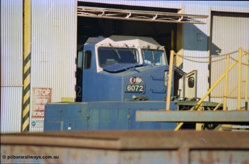 236-10
Nelson Point, Loco Overhaul Shop, BHP AC6000 class locomotive 6072 'Hesta', a General Electric built AC6000 model, serial 51064, seen here in the shed having the windscreen protectors or 'blinkers' fitted.
Keywords: 6072;GE;AC6000CW;51064;