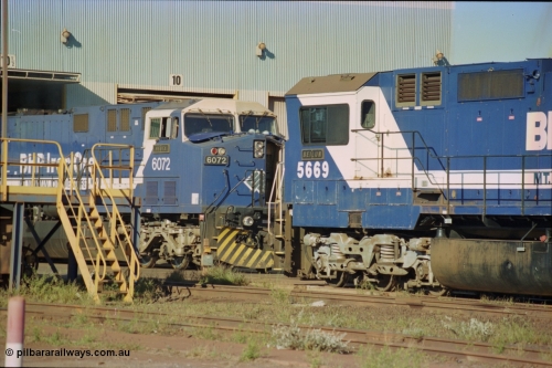 236-21
Nelson Point Loco Overhaul Shop, BHP Iron Ore's General Electric built AC6000 unit 6072 'Hesta' serial 51064 is having the new windscreen protectors or 'blinkers' fitted.
Keywords: 6072;GE;AC6000CW;51064;