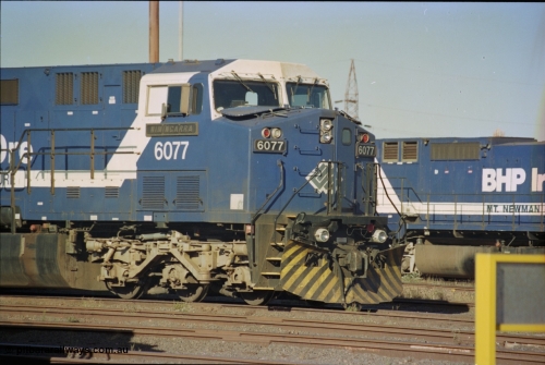 236-33
Nelson Point Loco Overhaul Shop, BHP Iron Ore's General Electric built AC6000 unit 6077 'Nimingarra' serial 51069 sits out the front.
Keywords: 6077;GE;AC6000CW;51069;
