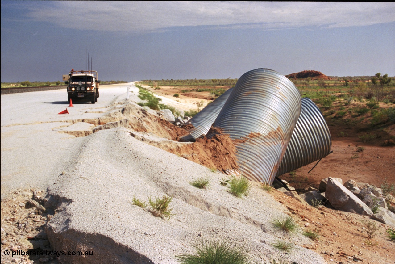 237-03
Water damaged culverts located on the upper reaches of the Edgina Creek, near the Woodstock South location on the BHP Newman line. [url=https://goo.gl/maps/kRVDYtxmRC42] Geo Data [/url].
