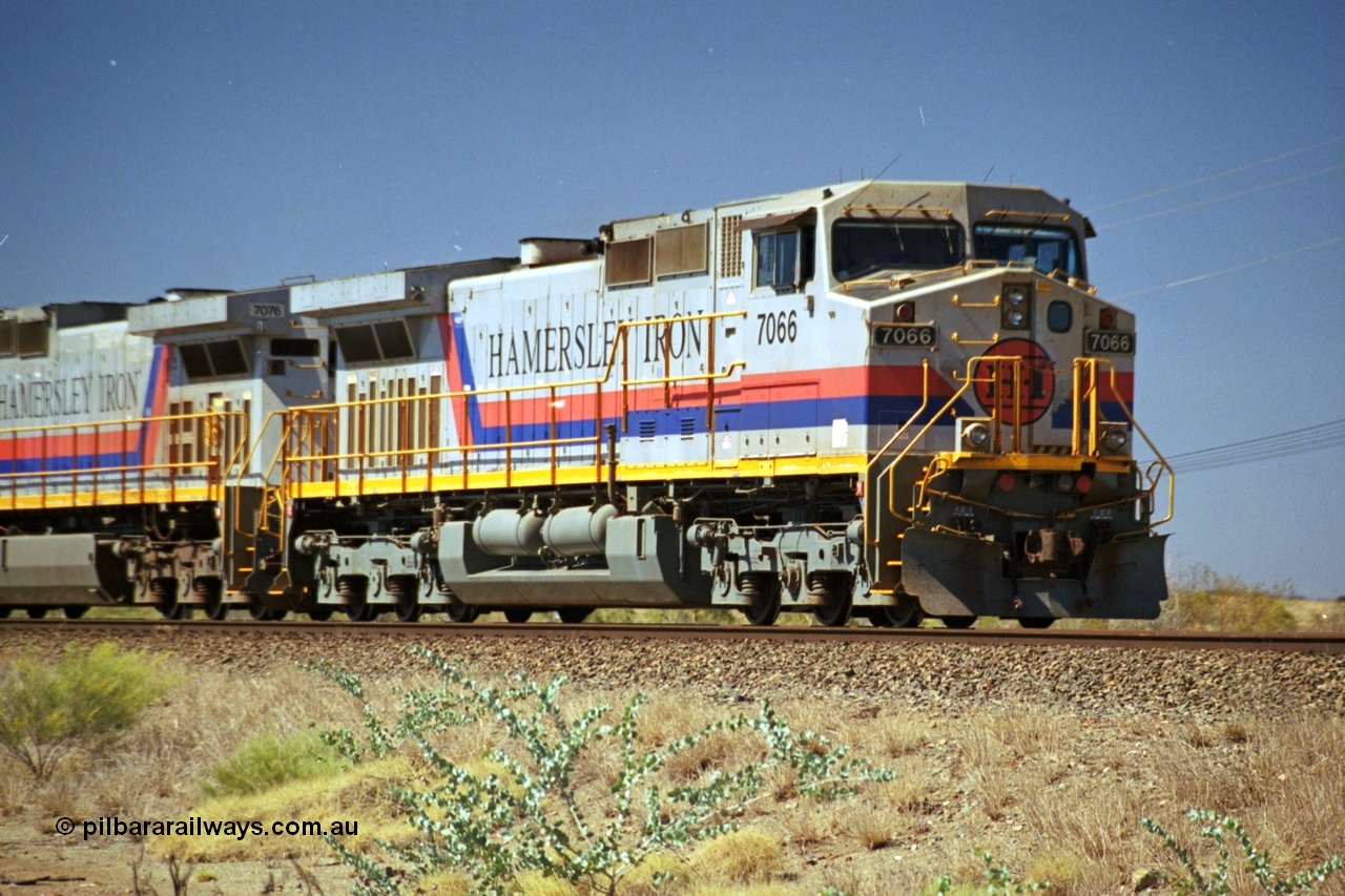 237-33
Dugite Siding, empty train in the passing track behind the standard pair of Hamersley Iron General Electric model Dash 9-44CW units 7066 serial 47745 and 7076. [url=https://goo.gl/maps/6og1H2khBAu] Geodata [/url].
Keywords: 7066;Dash-9-44CW;GE;47745;