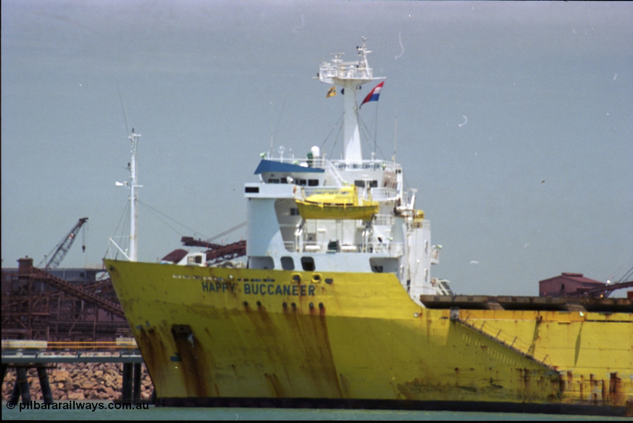 238-07
Port Hedland Harbour, heavy lift ship Happy Buccaneer (IMO: 8300389) sits at Finucane Island D Berth delivering a new shiploader for BHP Billiton. 1st November 2003. [url=https://goo.gl/maps/vWZoHTsRPsp] Geodata [/url]. Back in time here the ship cranes were only 550 tonne each, these are now 700.
Keywords: Happy-Buccaneer;Hitachi-Shipbuilding-Osaka-Japan;