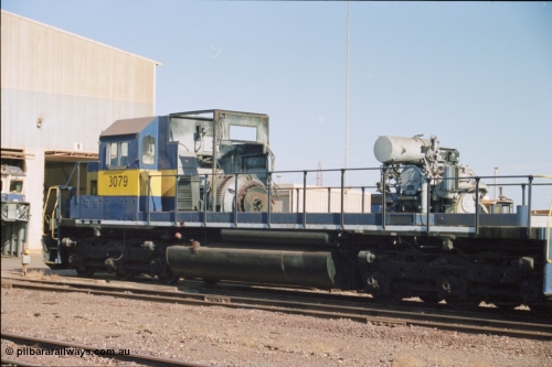238-19
Nelson Point loco overhaul shop sees former Southern Pacific loco 3079 EMD model SD40, serial number 7861-52 with the long hood removed due to the 645 prime mover failing not long after arrival in Australia. 27th January 2004. [url=https://goo.gl/maps/rqoN9uK26rQ2] Geodata [/url].
Keywords: 3079;EMD;SD40;31542/7861-52;SP8461;
