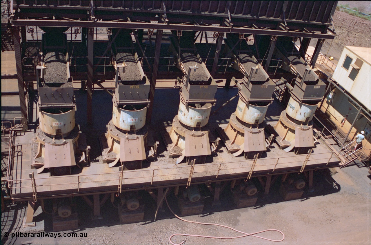 239-15
Looking down from the middling crushers to the original 'old side' bank of five tertiary crushers. Sub-Station 2 can be seen at right with the control room above that. [url=https://goo.gl/maps/2oJ3zTdoX1p]GeoData[/url].
