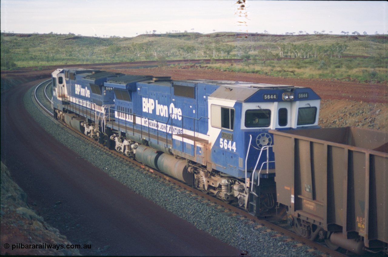 239-37
Yandi Two, train loading is under way with a pair of Goninan rebuild units, CM40-8MEFI unit 5668 'Dunkirk' serial 8412-01/95-159 and CM40-8M unit 5644 'Kangan' serial 8281-09/92-133. The lead unit was originally Comeng NSW built ALCo M636 5489 serial C6084-5, while second unit 5644 was originally a AE Goodwin built ALCo M636 5471 serial G6047-3.
