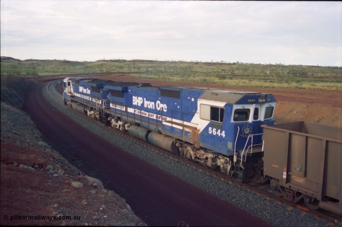 239-36
Yandi Two, train loading is under way with a pair of Goninan rebuild units, CM40-8MEFI unit 5668 'Dunkirk' serial 8412-01/95-159 and CM40-8M unit 5644 'Kangan' serial 8281-09/92-133. The lead unit was originally Comeng NSW built ALCo M636 5489 serial C6084-5, while second unit 5644 was originally a AE Goodwin built ALCo M636 5471 serial G6047-3.
