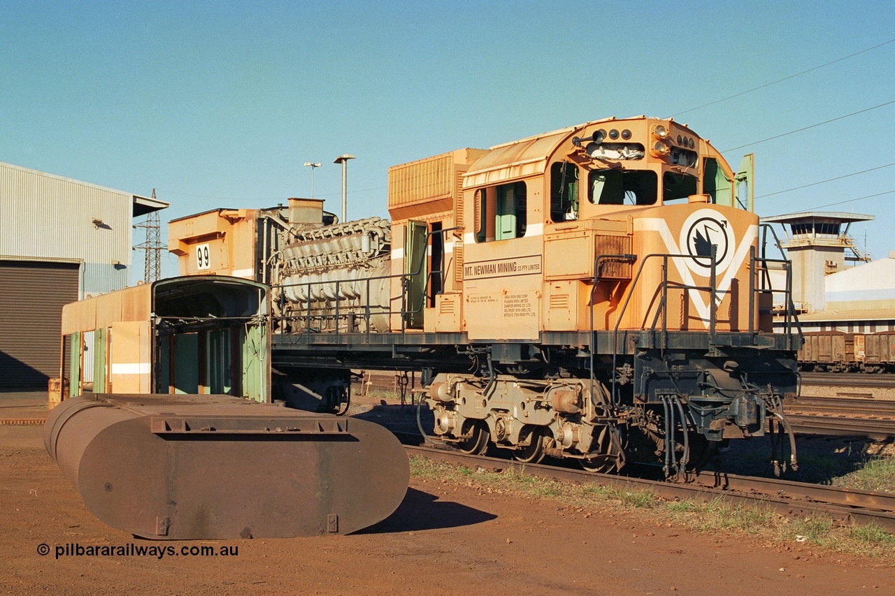 240-01
Nelson Point, retired Mt Newman Mining Comeng NSW built ALCo M636 unit 5499 serial C6096-4 sits awaiting its engine removal prior to being sent by road to Rail Heritage WA's Museum at Bassendean, Perth for preservation. 25th June 2002.
Keywords: 5499;Comeng-NSW;ALCo;M636;C6096-4;