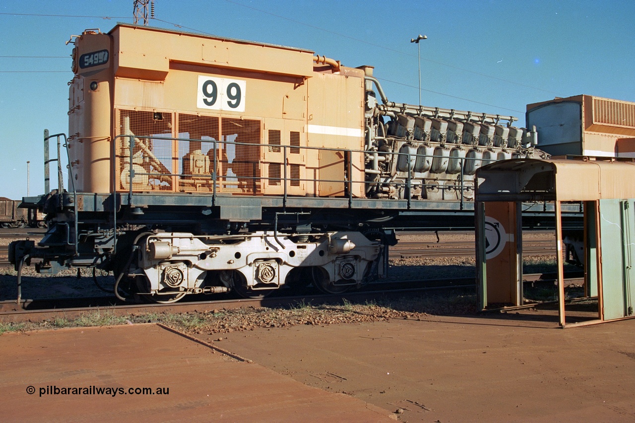 240-04
Nelson Point, retired Mt Newman Mining Comeng NSW built ALCo M636 unit 5499 serial C6096-4 sits with the hood removed exposing the ALCo 251F engine, radiator fan drive and oil filter assembly prior to engine removal and being sent by road to Rail Heritage WA's Bassendean museum for preservation. 25th June 2002.
Keywords: 5499;Comeng-NSW;ALCo;M636;C6096-4;251F;