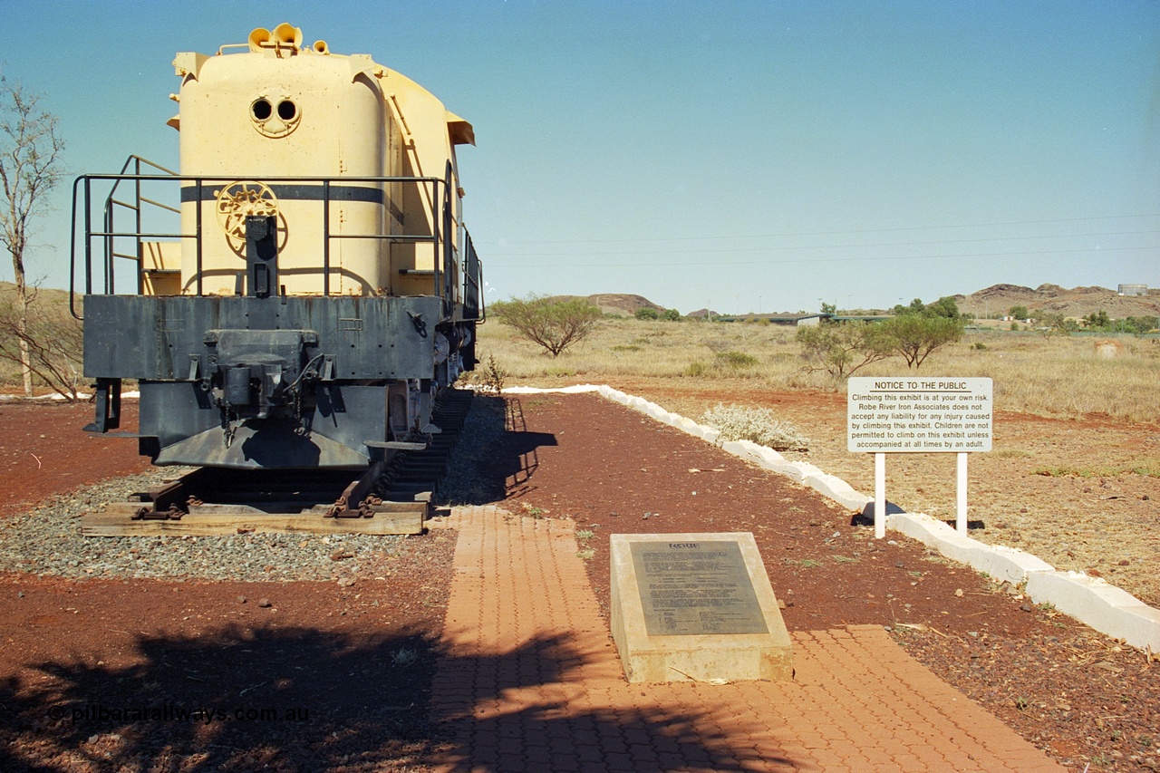 240-25
Wickham town entry statement, former Cliffs Robe River Iron Associates RSD-3 model ALCo locomotive built by Montreal Locomotive Works (MLW) in 1951 for NSWGR as the 40 class 4006 serial 77737, purchased by CRRIA in 1971 and numbered 261.001, then 1700 and finally 9401. It has been repainted into Robe colours and was donated to the local Lions' Club when retired and displayed as an entry statement to the township. View on the rail plinth and plaque at the entry into town. 31st August 2002.
Keywords: 9401;MLW;ALCo;RSC3;77737;40-class;4006;