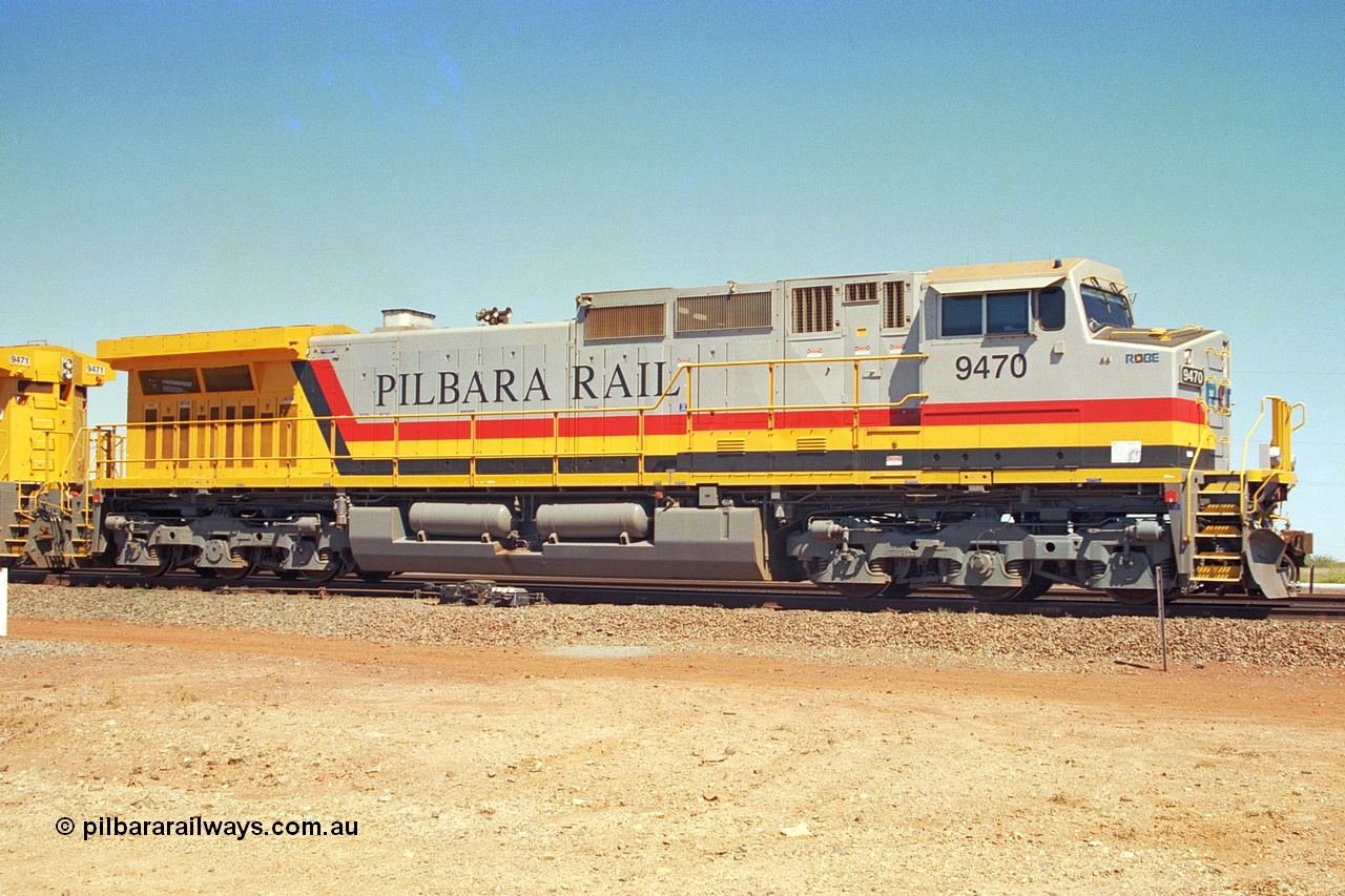 240-31
Seven Mile, Pilbara Rail, Robe River owned, General Electric built Dash 9-44CW unit 9470 serial 53455. This and sister units 9471 and 9472 were the first painted in the Pilbara Rail livery. 31st August 2002.
Keywords: 9470;GE;Dash-9-44CW;53455;