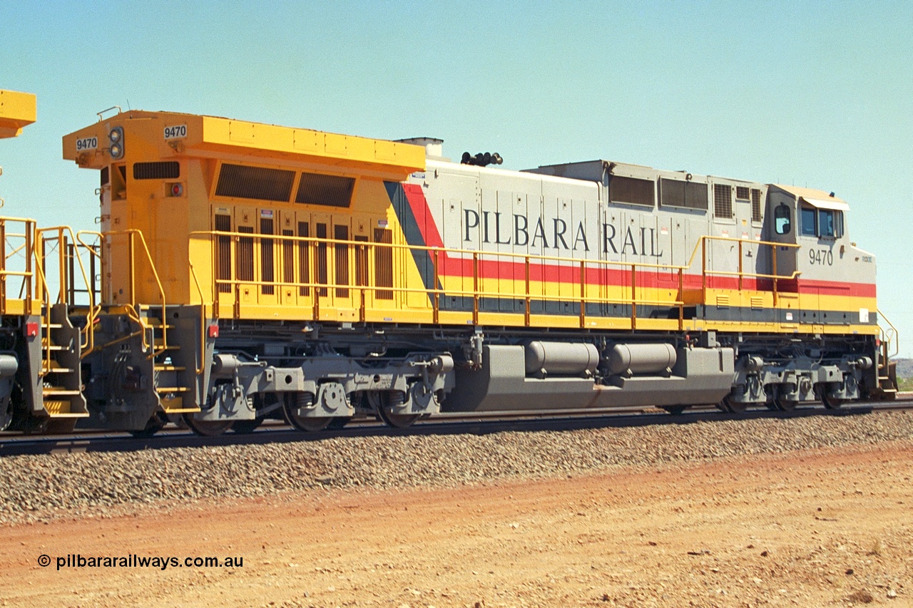 240-32
Seven Mile, trailing view of Pilbara Rail, Robe River owned, General Electric built Dash 9-44CW unit 9470 serial 53455. This and sister units 9471 and 9472 were the first painted in the Pilbara Rail livery. 31st August 2002.
Keywords: 9470;GE;Dash-9-44CW;53455;