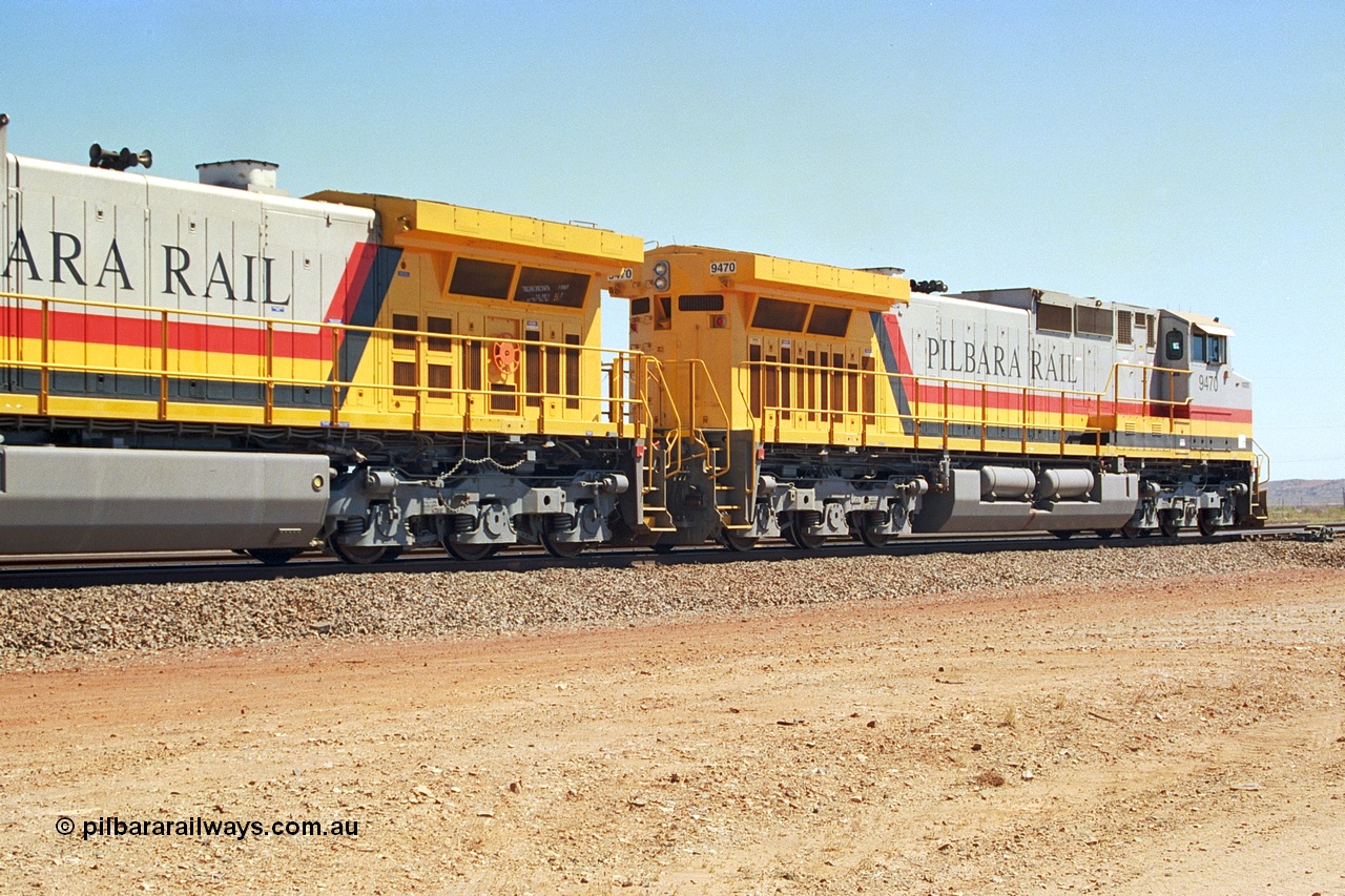 240-33
Seven Mile, trailing view of Pilbara Rail, Robe River owned, General Electric built Dash 9-44CW unit 9470 serial 53455. This and sister units 9471 and 9472 were the first painted in the Pilbara Rail livery. 31st August 2002.
Keywords: 9470;GE;Dash-9-44CW;53455;