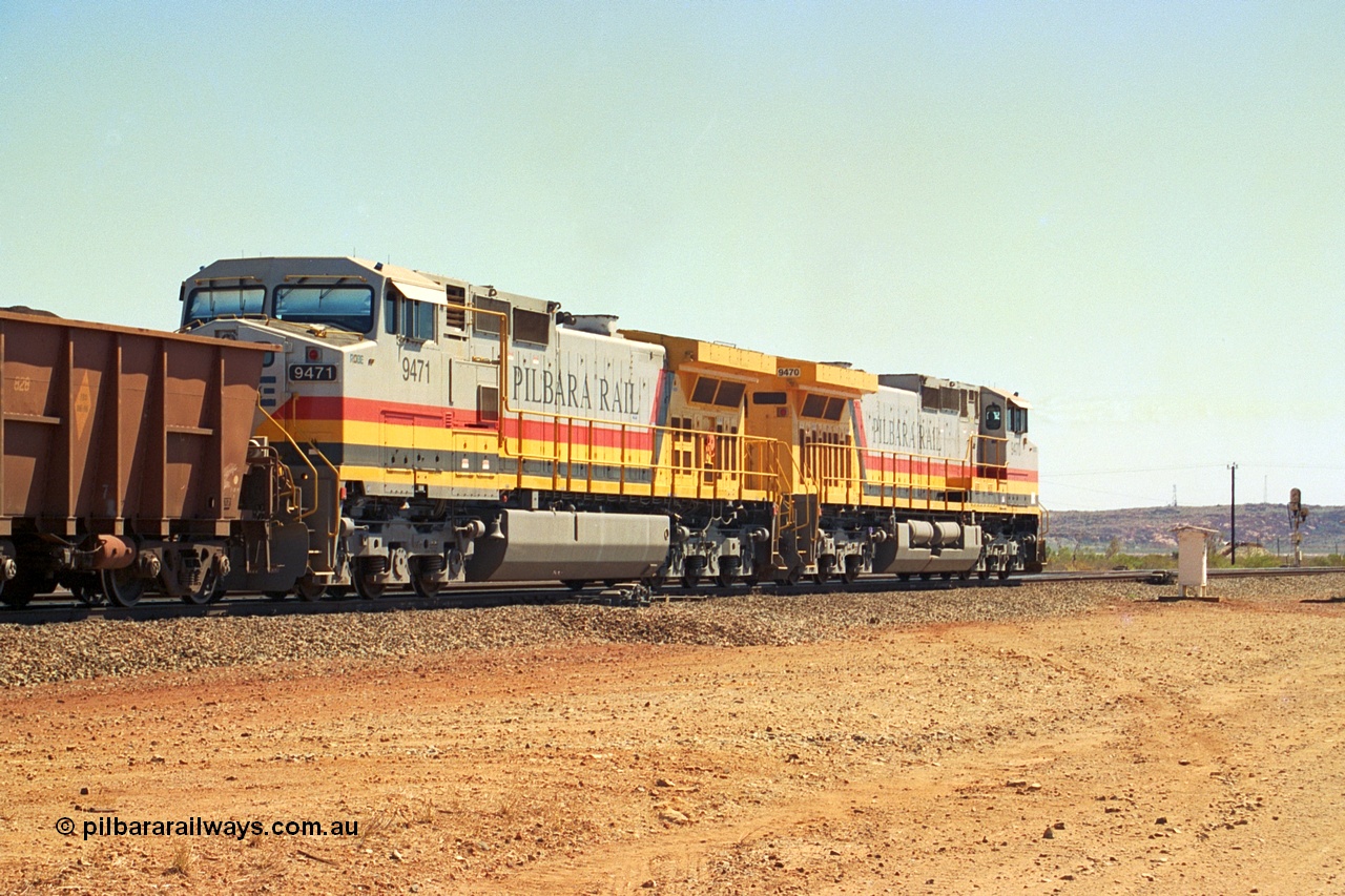 240-35
Seven Mile, trailing view of a loaded train heading for Parker Point behind a pair of Pilbara Rail, Robe River owned, General Electric built Dash 9-44CW units 9470 serial 53455 and 9471 serial 53456. These and sister unit 9472 were the first painted in the Pilbara Rail livery. 31st August 2002.
Keywords: 9470;9471;GE;Dash-9-44CW;53455;53456