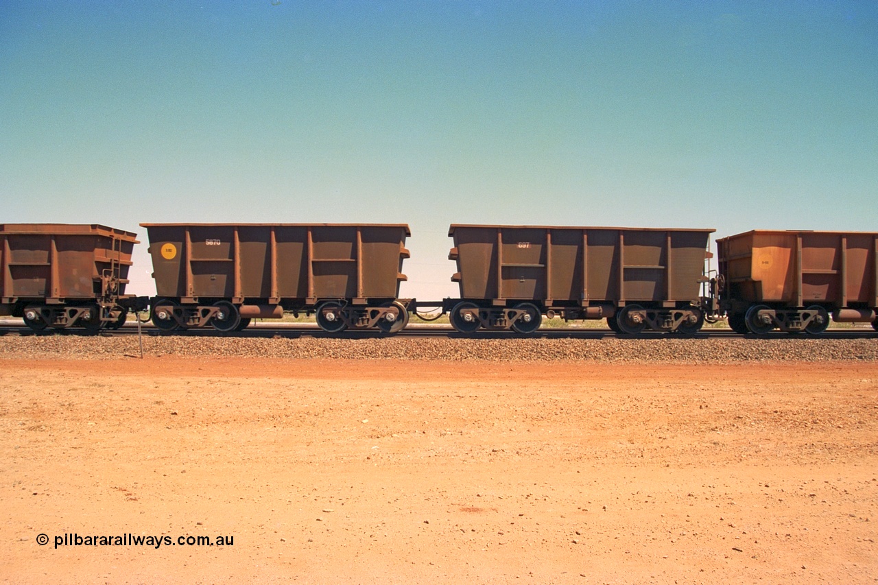 240-36
Seven Mile, a pair of re-walled Nippon Sharyo built waggons, control waggon 697 on the right with slave waggon 5870 on a loaded train bound of the Parker Point tippler. 31st August 2002.
Keywords: Nippon-Sharyo-Japan;