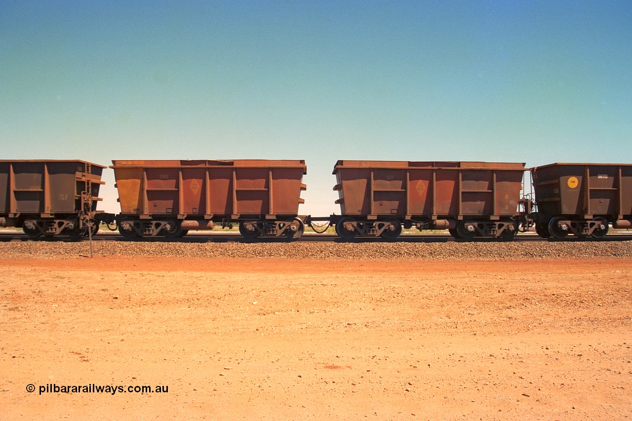 240-37
Seven Mile, a pair of loaded Nippon Sharyo ore waggons, control waggon 021 on the right with slave waggon 068 and with hungry boards fitted to the top. 31st August 2002.
Keywords: Nippon-Sharyo-Japan;