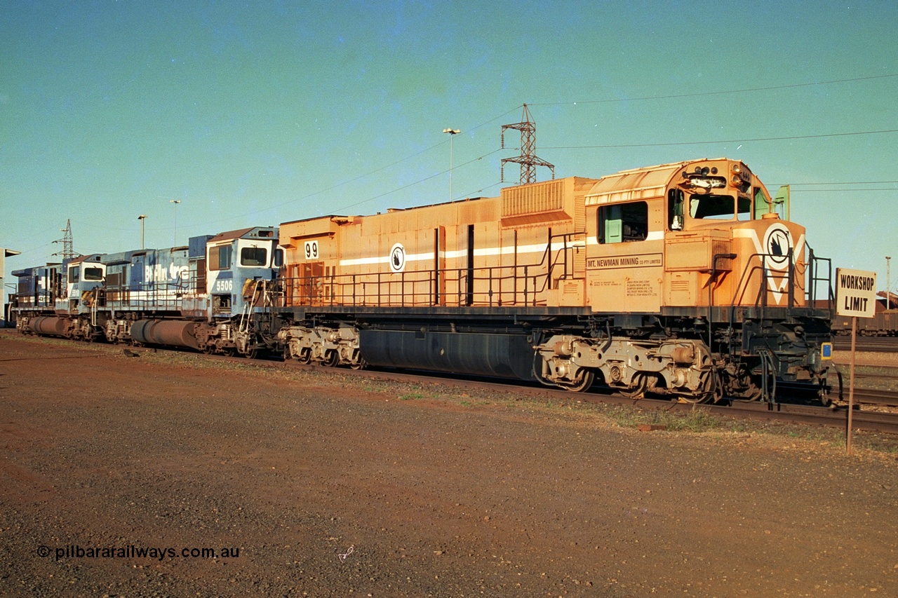 241-02
Nelson Point, Mt Newman Mining's last in-service ALCo M636 unit 5499 serial C6096-4 built by Comeng NSW sits awaiting partial dismantling before being sent by road to Rail Heritage WA's museum at Bassendean, Perth for preservation with two C36-7M units 5506 and 5510 also awaiting removal from site. June 2002.
Keywords: 5499;Comeng-NSW;ALCo;M636;C6096-4;