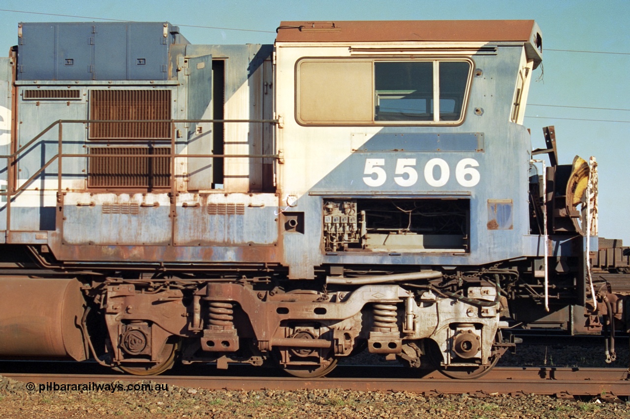 241-08
Nelson Point, Goninan GE rebuild C36-7M unit 5506 serial 4839-01 / 87-071 is in the process of being removed from site bound for Asset Kinetics in Maddington, Perth. Drivers cab side view. 5506 was rebuilt from NSW AE Goodwin built C636 ALCo number 5455 serial G6012-04 and was delivered in Mt Newman orange livery and originally named 'Mt Whaleback', after repainting into BHP blue was named 'Ethel Creek', then finally 'Mt Goldsworthy'. June 2002.
Keywords: 5506;Goninan;GE;C36-7M;4839-01/87-071;rebuild;AE-Goodwin;ALCo;C636;5455;G6012-4;