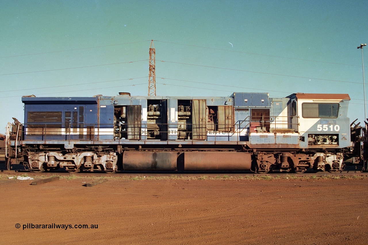 241-14
Nelson Point, Goninan GE rebuild C36-7M unit 5510 serial 4839-07 / 87-075 is in the process of being removed from site bound for Asset Kinetics in Maddington, Perth. Drivers side view with hood doors open, the Dash 8 radiator frame fitted to it following collision repairs is also evident. June 2002.
Keywords: 5510;Goninan;GE;C36-7M;4839-07/87-075;rebuild;AE-Goodwin;ALCO;C636;5458;G6027-2;