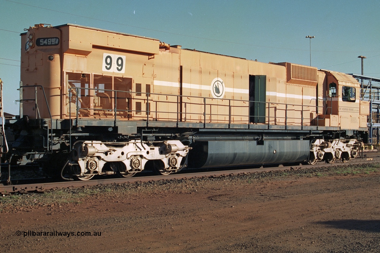 241-19
Nelson Point, Mt Newman Mining's last in-service ALCo M636 unit 5499 serial C6096-4 built by Comeng NSW sits awaiting partial dismantling before being sent by road to Rail Heritage WA's museum at Bassendean, Perth for preservation. Three quarter rear view. June 2002.
Keywords: 5499;Comeng-NSW;ALCo;M636;C6096-4;