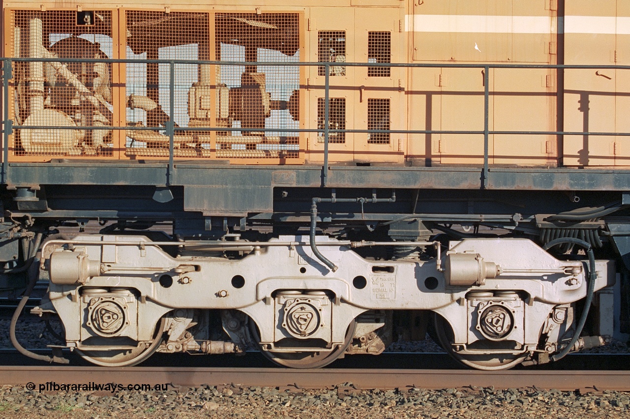 241-21
Nelson Point, Mt Newman Mining's last in-service ALCo M636 unit 5499 serial C6096-4 built by Comeng NSW sits awaiting partial dismantling before being sent by road to Rail Heritage WA's museum at Bassendean, Perth for preservation. Drivers side view of the radiator section and bogie. June 2002.
Keywords: 5499;Comeng-NSW;MLW-ALCo;M636;C6096-4;