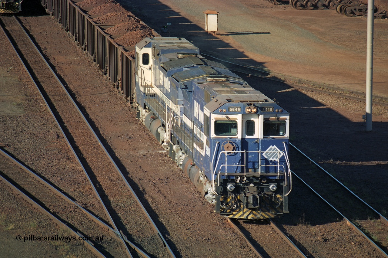 241-29
Nelson Point, Car Dumper 2 holding roads, a pair of CM40-8M units 5649 'Pohang' and 5640 'Ethel Creek' wait their turn through the dumper to discharge. June 2002.
Keywords: 5649;Goninan;GE;CM40-8M;8412-07/93-140;rebuild;AE-Goodwin;ALCo;M636C;5473;G6047-5;