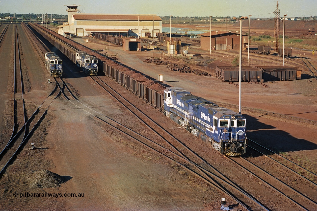 241-32
Nelson Point, Car Dumper 2 holding roads with Yard Control tower and Ore Car Repair Shop in the background as three loaded ore rakes behind a pair of CM40-8M units on each wait their turn through the dumper to discharge. June 2002.
Keywords: 5649;Goninan;GE;CM40-8M;8412-07/93-140;rebuild;AE-Goodwin;ALCo;M636C;5473;G6047-5;