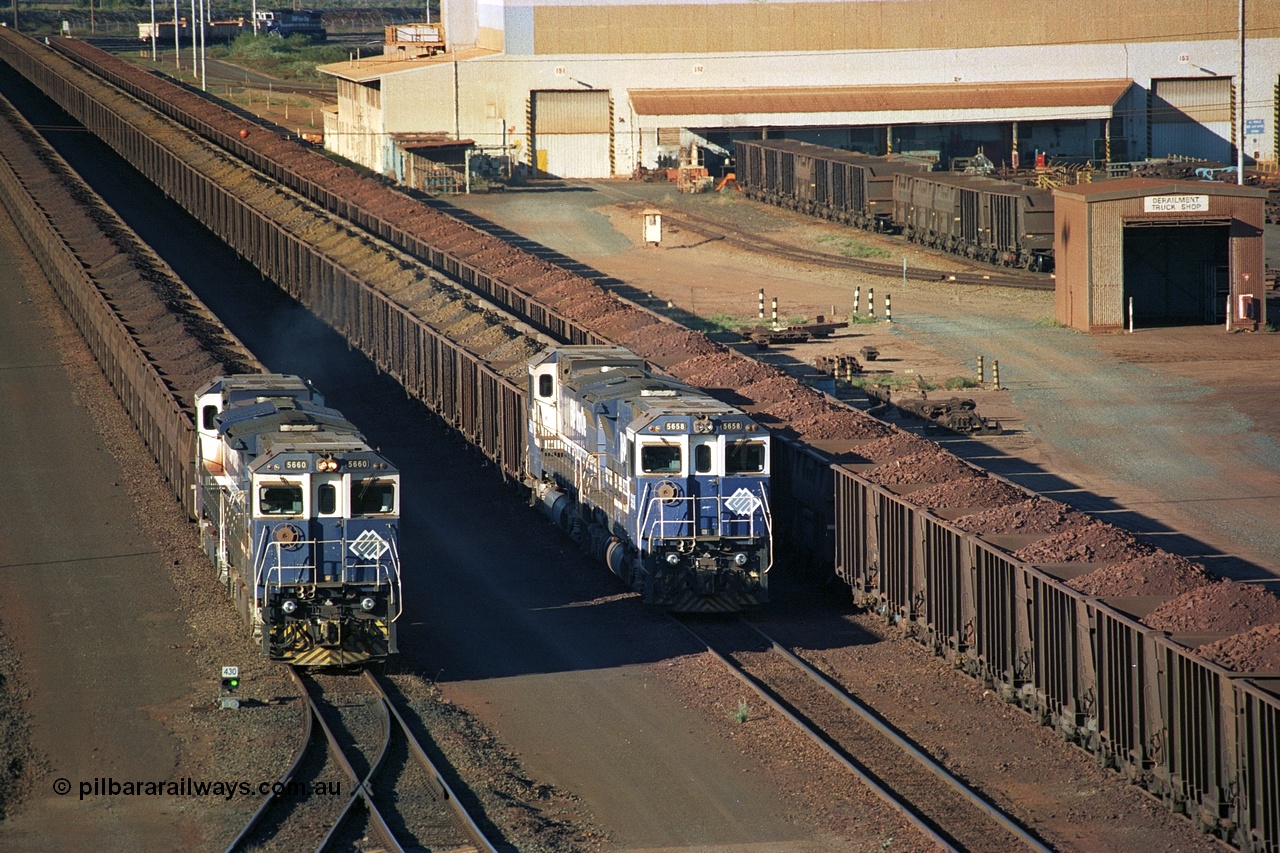 241-33
Nelson Point, Car Dumper 2 holding roads, a pair of CM40-8M units 5660 'Kure' serial 8412-05 / 94-151 and 5657 'Fukuyama' drag their loaded train towards the dumper to discharge passing a similar consist with the Ore Car Repair Shop in the background. June 2002.
Keywords: 5660;Goninan;GE;CM40-8M;8412-05/94-151;rebuild;AE-Goodwin;ALCo;M636C;5478;G6047-10;