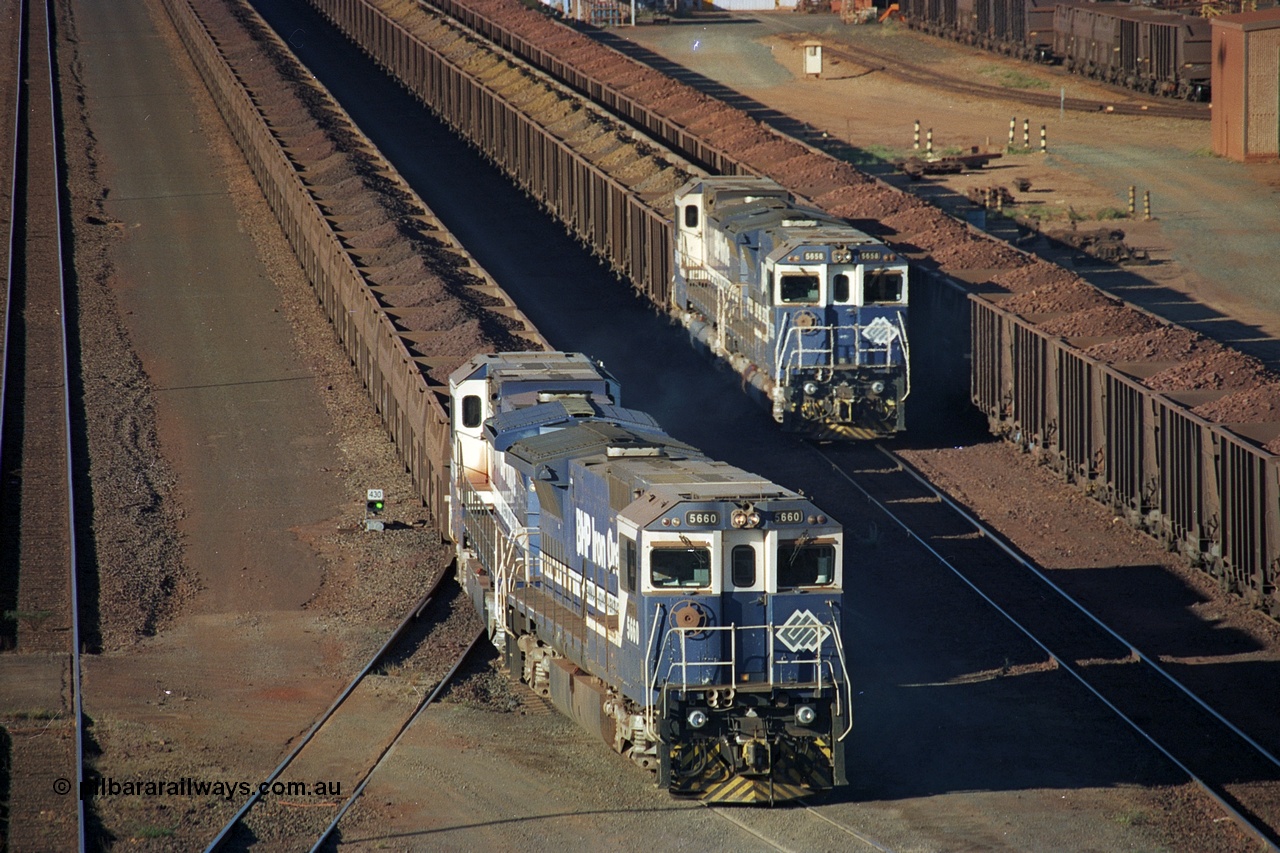 241-34
Nelson Point, Car Dumper 2 holding roads, a pair of CM40-8M units 5660 'Kure' serial 8412-05 / 94-151 and 5657 'Fukuyama' drag their loaded train towards the dumper to discharge passing a similar consist. June 2002.
Keywords: 5660;Goninan;GE;CM40-8M;8412-05/94-151;rebuild;AE-Goodwin;ALCo;M636C;5478;G6047-10;