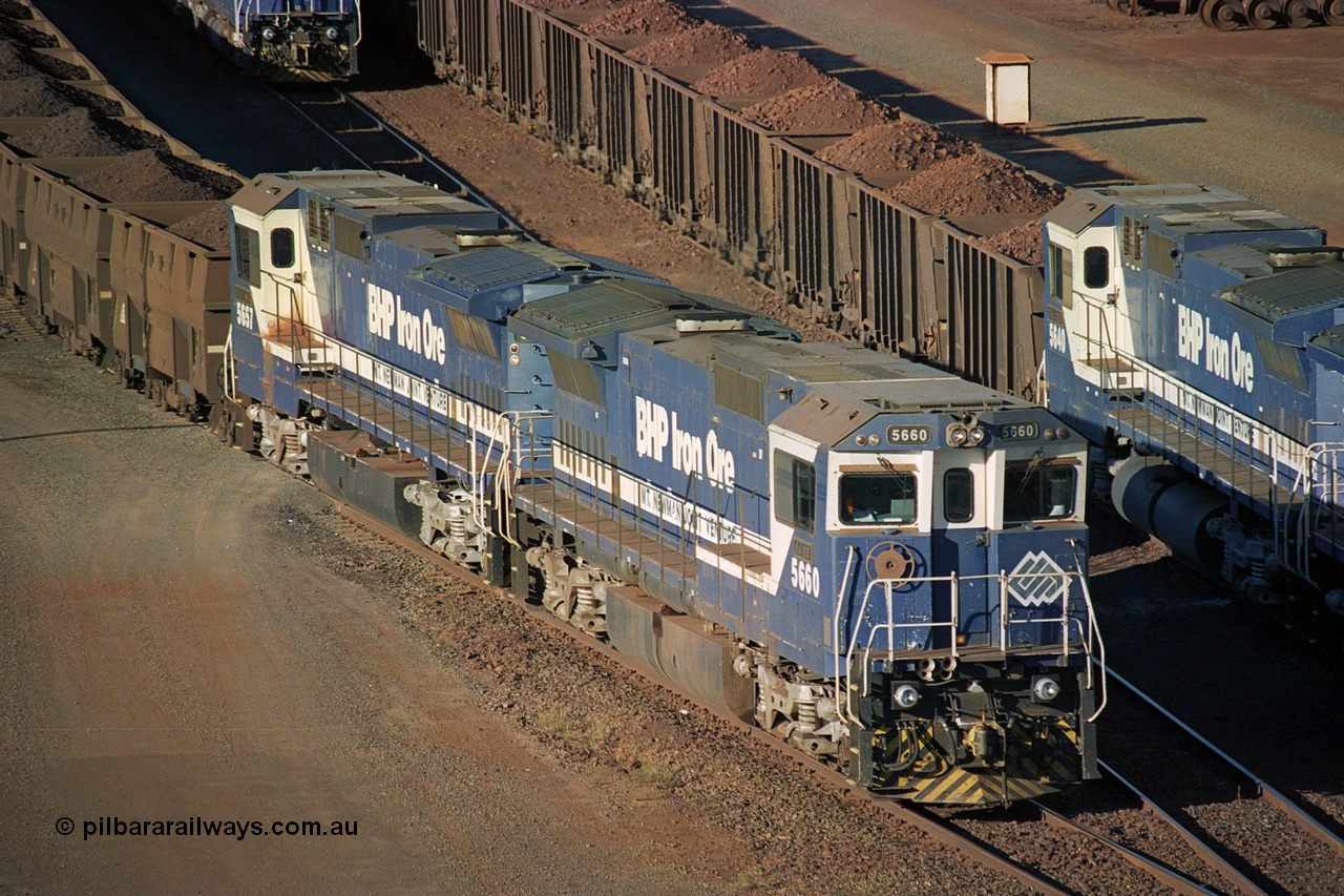 241-37
Nelson Point, Car Dumper 2 holding roads, two loaded ore rakes behind pairs of CM40-8M units on each wait their turn through the dumper to discharge as 5660 'Kure' serial 8412-05 / 94-151 and 5657 'Fukuyama' drag their loaded train towards the dumper to discharge . June 2002.
Keywords: 5660;Goninan;GE;CM40-8M;8412-05/94-151;rebuild;AE-Goodwin;ALCo;M636C;5478;G6047-10;