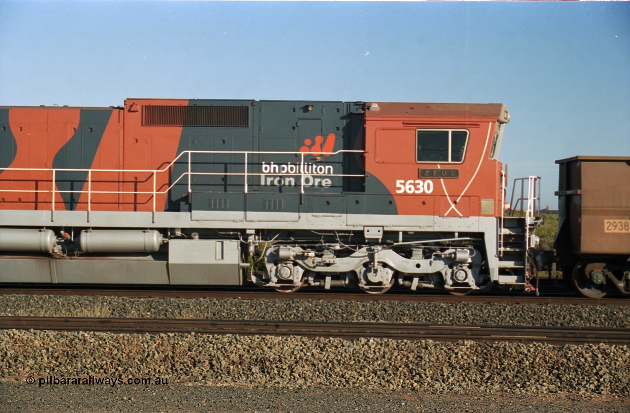 243-11
Nelson Point departure yard, BHP Billiton's CM39-8 unit 5630 'Zeus' serial 5831-09 / 88-079 and built new by Goninan in the new 'earth' or 'bubble' livery as it trails an empty train waiting departure time. August 2003.
Keywords: 5630;Goninan;GE;CM39-8;5831-09/88-079;