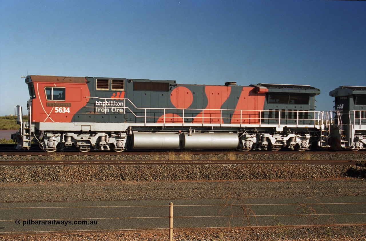 243-23
Nelson Point departure yard, BHP Billiton's CM40-8M unit 5634 'Boodarie' a Goninan WA GE rebuild unit serial 8151-07 / 91-120 in the new 'earth' or 'bubble' livery as it heads up an empty train waiting departure time. August 2003.
Keywords: 5634;Goninan;GE;CM40-8M;8151-07/91-120;rebuild;AE-Goodwin;ALCo;C636;5457;G6027-1;